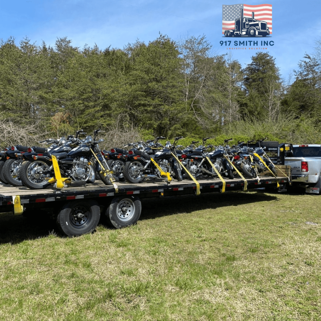 Hotshot flatbed trailer loaded with motorcycles on the highway