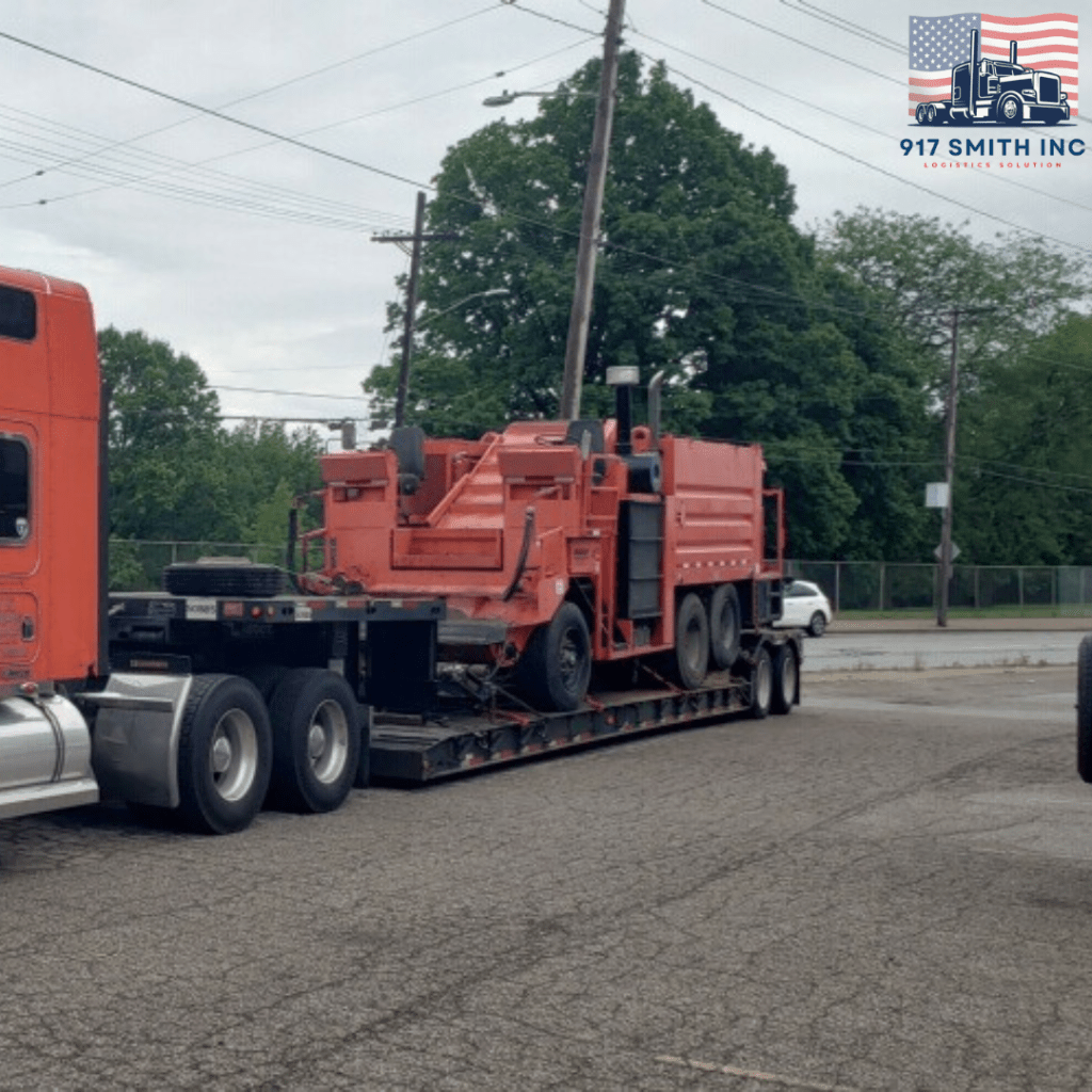 Concrete mixer being transported on a lowboy